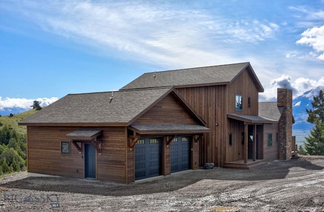 16 Sagittarius Skwy, Emigrant, MT 59027 - chalet / cabin with a shingled roof, a garage, and a chimney