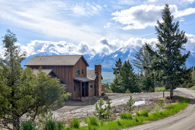 16 Sagittarius Skwy, Emigrant, MT 59027 - view of property exterior featuring a chimney and a mountain view
