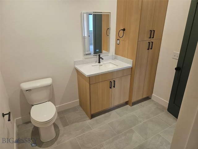 1102 Ridgeview Trl, Livingston, MT 59047 - bathroom with toilet, vanity, and baseboards