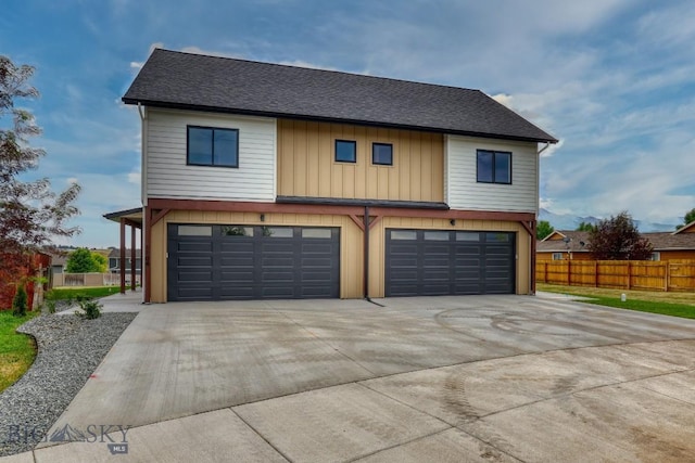 1102 Ridgeview Trl, Livingston, MT 59047 - view of front of home featuring an attached garage, concrete driveway, roof with shingles, and board and batten siding