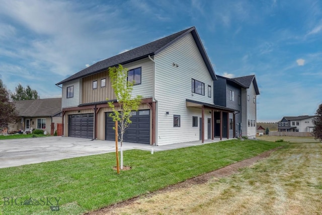 1102 Ridgeview Trl, Livingston, MT 59047 - view of property featuring a garage, concrete driveway, a front yard, and board and batten siding