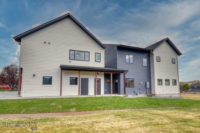 1102 Ridgeview Trl, Livingston, MT 59047 - rear view of house featuring a lawn and a patio area