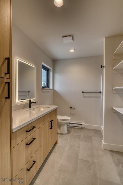 1102 Ridgeview Trl, Livingston, MT 59047 - full bathroom with a baseboard heating unit and vanity