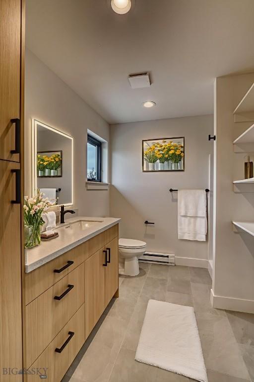 1102 Ridgeview Trl, Livingston, MT 59047 - bathroom featuring a baseboard heating unit, vanity, and tile patterned flooring