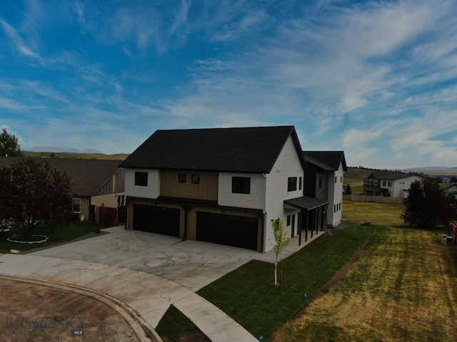 1102 Ridgeview Trl, Livingston, MT 59047 - view of front of property featuring an attached garage, driveway, and a front lawn