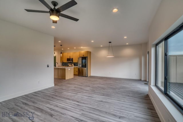 1102 Ridgeview Trl, Livingston, MT 59047 - unfurnished living room featuring recessed lighting, light wood-type flooring, and a ceiling fan