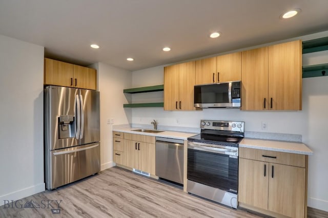 1102 Ridgeview Trl, Livingston, MT 59047 - kitchen featuring appliances with stainless steel finishes, open shelves, light countertops, light wood-type flooring, and recessed lighting