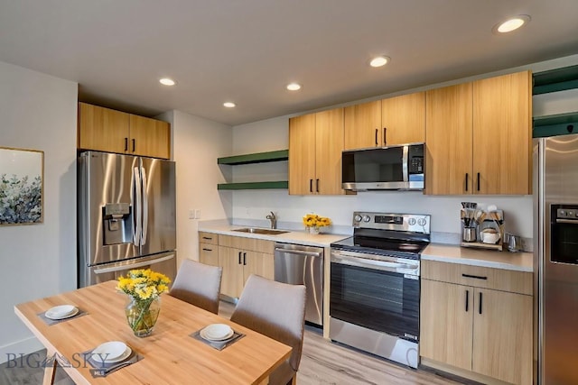 1102 Ridgeview Trl, Livingston, MT 59047 - kitchen with appliances with stainless steel finishes, open shelves, light countertops, recessed lighting, and light brown cabinets