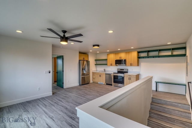 1102 Ridgeview Trl, Livingston, MT 59047 - kitchen featuring appliances with stainless steel finishes, recessed lighting, a ceiling fan, light wood-type flooring, and light countertops