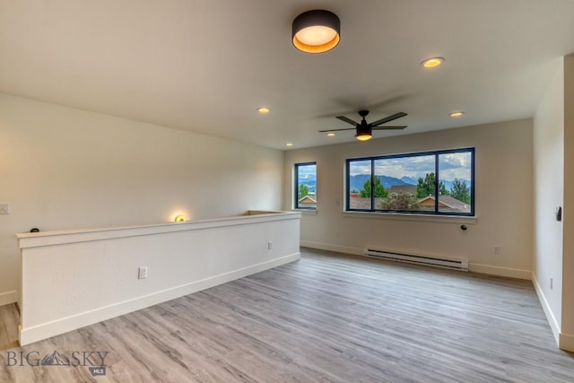 1102 Ridgeview Trl, Livingston, MT 59047 - unfurnished room with baseboard heating, wood finished floors, a ceiling fan, and recessed lighting