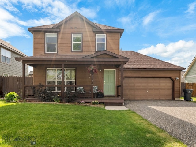 1009 Wyoming St, Belgrade, MT 59714 - view of front of home with covered porch, asphalt driveway, roof with shingles, and a garage