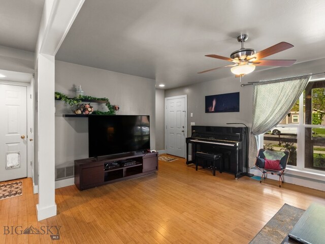 1009 Wyoming St, Belgrade, MT 59714 - living area featuring hardwood / wood-style floors, ceiling fan, and recessed lighting