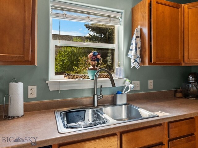 1009 Wyoming St, Belgrade, MT 59714 - kitchen with brown cabinetry