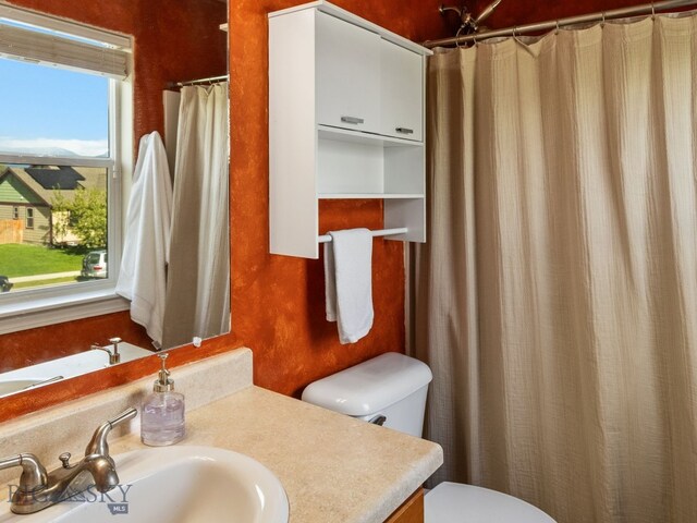 1009 Wyoming St, Belgrade, MT 59714 - full bath with vanity and a shower with shower curtain