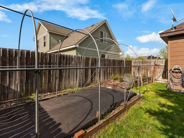 1009 Wyoming St, Belgrade, MT 59714 - view of sport court with a fenced backyard