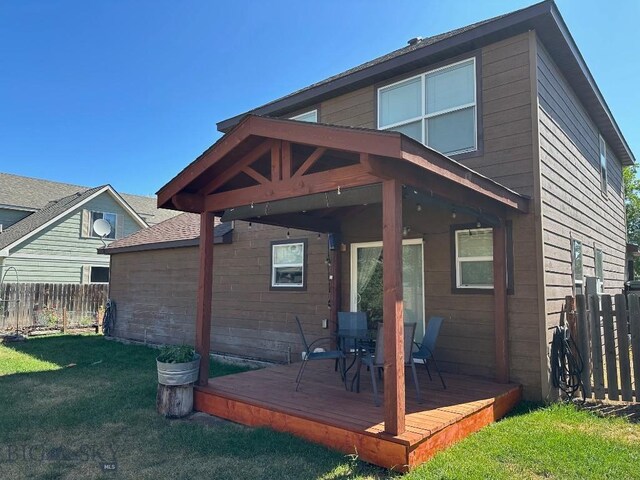 1009 Wyoming St, Belgrade, MT 59714 - rear view of property with a fenced backyard and a deck