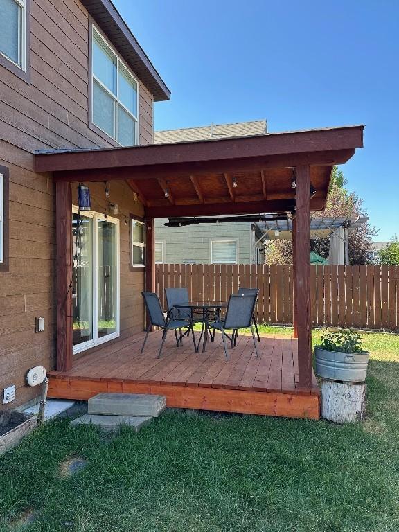 1009 Wyoming St, Belgrade, MT 59714 - wooden deck with outdoor dining area