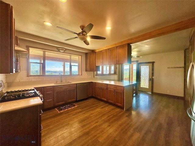400 Broken Creek Rd, Three Forks, MT 59752 - kitchen with a sink, stainless steel appliances, dark wood-style flooring, decorative backsplash, and brown cabinets