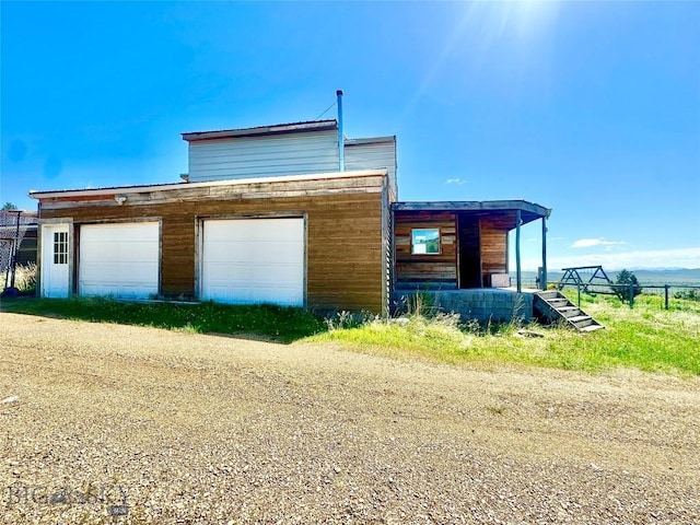 400 Broken Creek Rd, Three Forks, MT 59752 - view of side of property featuring dirt driveway and an outbuilding