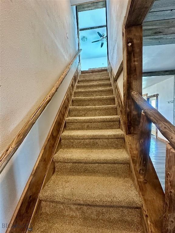 400 Broken Creek Rd, Three Forks, MT 59752 - staircase with a textured wall and carpet
