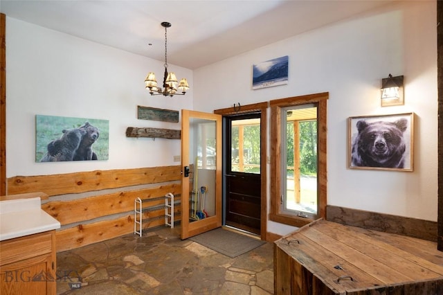 495 Jardine Rd, Gardiner, MT 59030 - entrance foyer with dark stone finish flooring and a chandelier