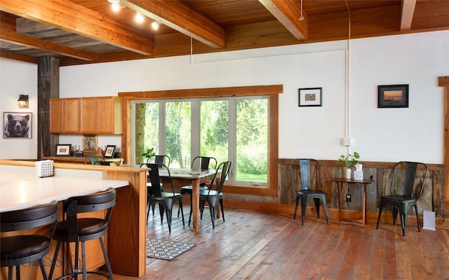 495 Jardine Rd, Gardiner, MT 59030 - dining area with wooden ceiling with exposed beams, hardwood / wood-style floors, and wainscoting