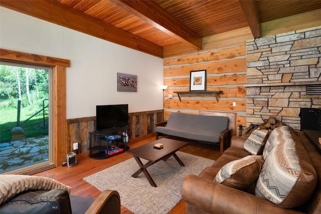 495 Jardine Rd, Gardiner, MT 59030 - living area featuring wood ceiling with exposed beams, wood finished floors, wooden walls, and wainscoting