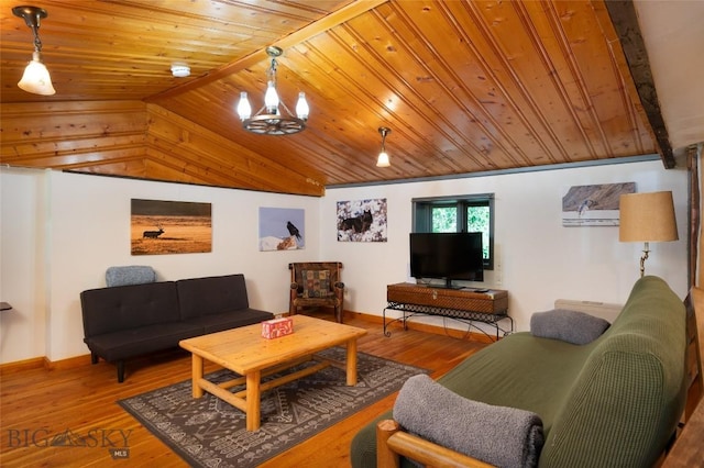 495 Jardine Rd, Gardiner, MT 59030 - living area with wood ceiling, lofted ceiling, a chandelier, wood finished floors, and baseboards