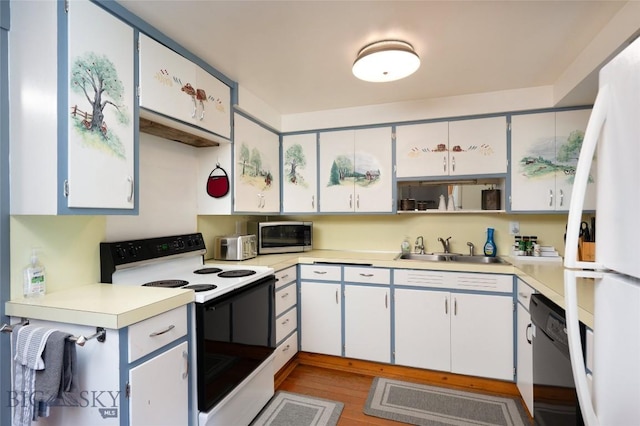 495 Jardine Rd, Gardiner, MT 59030 - kitchen featuring white appliances, a sink, light countertops, and light wood finished floors