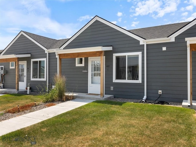 407 Brookline St Unit A, Livingston, MT 59047 - view of front of home with a front lawn and a shingled roof