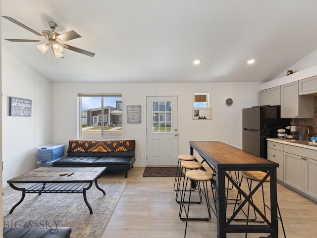 407 Brookline St Unit A, Livingston, MT 59047 - living area featuring lofted ceiling, light wood finished floors, a ceiling fan, and recessed lighting