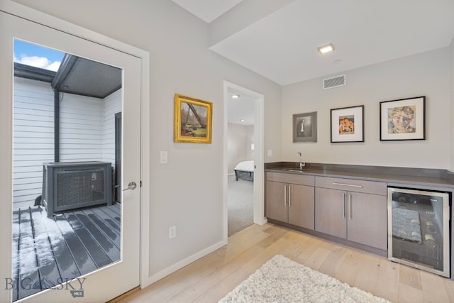 519 E Mendenhall St, Bozeman, MT 59715 - indoor wet bar with wine cooler, light wood-style flooring, and baseboards