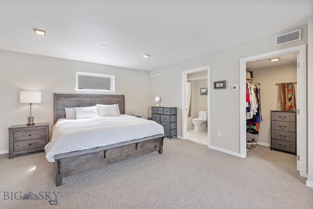 519 E Mendenhall St, Bozeman, MT 59715 - carpeted bedroom featuring a spacious closet, baseboards, ensuite bathroom, and a closet