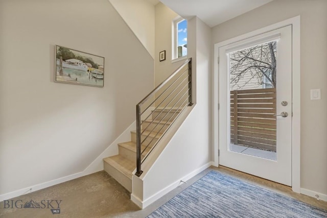 519 E Mendenhall St, Bozeman, MT 59715 - entryway with stairs, baseboards, and carpet