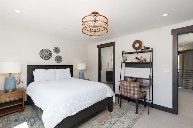 carpeted bedroom featuring recessed lighting, baseboards, and ensuite bathroom