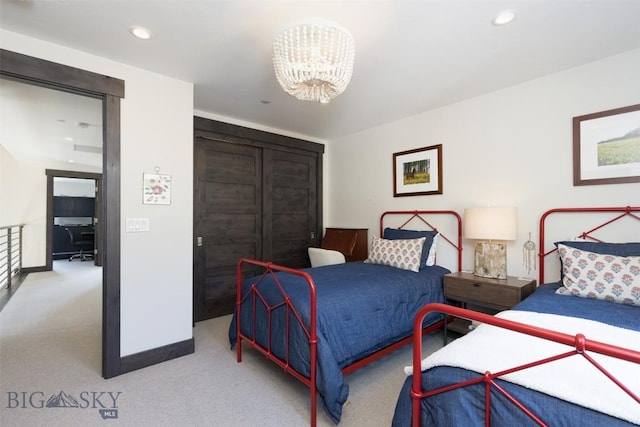 bedroom with a chandelier, carpet floors, recessed lighting, and baseboards