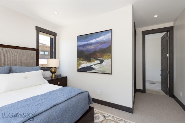 bedroom featuring baseboards, recessed lighting, and light colored carpet