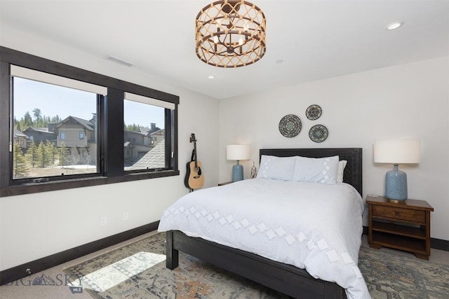 bedroom with baseboards, recessed lighting, a chandelier, and carpet flooring