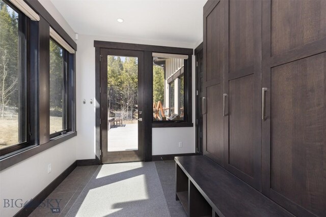 mudroom with baseboards and recessed lighting