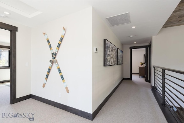 corridor with carpet floors, baseboards, and recessed lighting