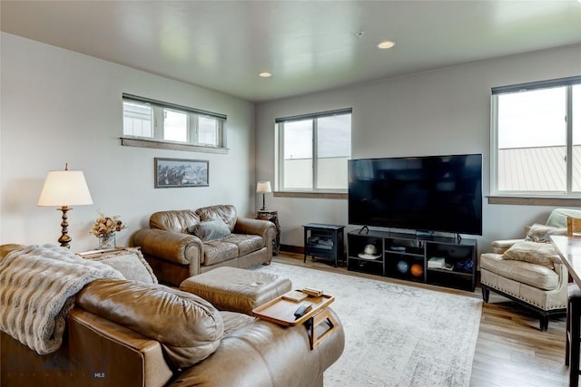 33 Intrepid Dr, Bozeman, MT 59718 - living area featuring plenty of natural light, wood finished floors, and recessed lighting