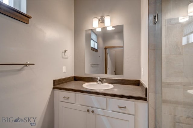33 Intrepid Dr, Bozeman, MT 59718 - bathroom with vanity, a tile shower, and plenty of natural light