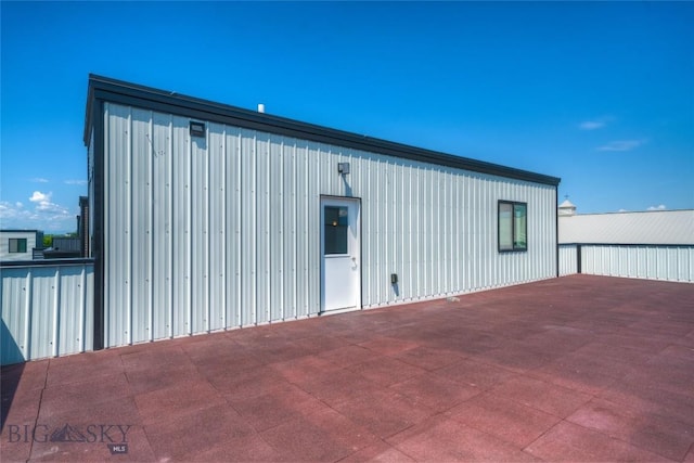 33 Intrepid Dr, Bozeman, MT 59718 - view of home's exterior featuring board and batten siding and a patio