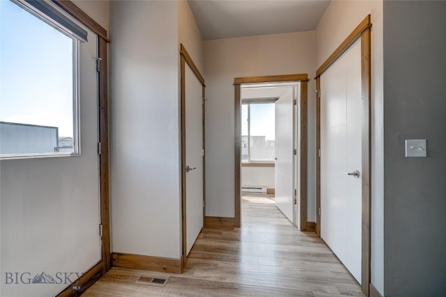 33 Intrepid Dr, Bozeman, MT 59718 - hallway featuring baseboard heating and light wood-style floors