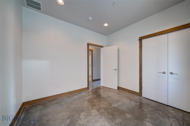 33 Intrepid Dr, Bozeman, MT 59718 - unfurnished bedroom with concrete flooring, a closet, and recessed lighting