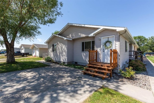 108 10th St Unit B, Belgrade, MT 59714 - view of front facade with crawl space and a patio area