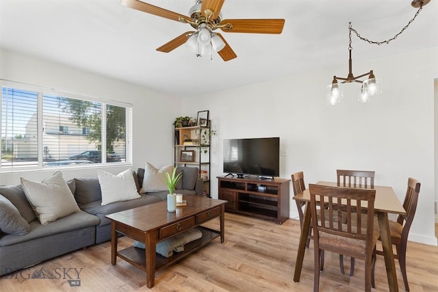 108 10th St Unit B, Belgrade, MT 59714 - living area featuring light wood-style flooring, a chandelier, and a ceiling fan