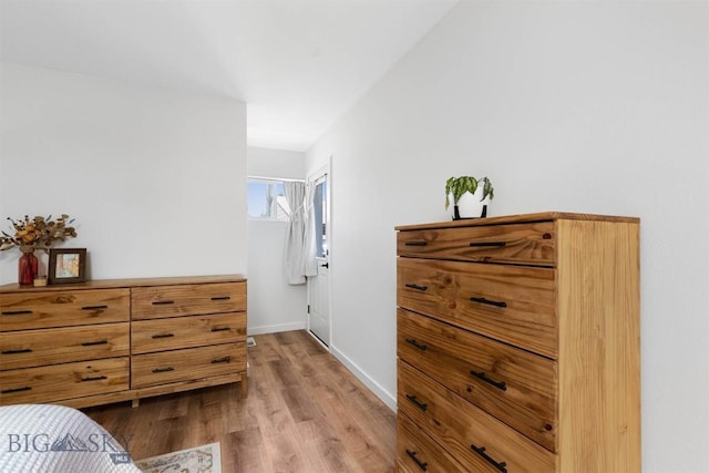 108 10th St Unit B, Belgrade, MT 59714 - bedroom featuring wood finished floors and baseboards