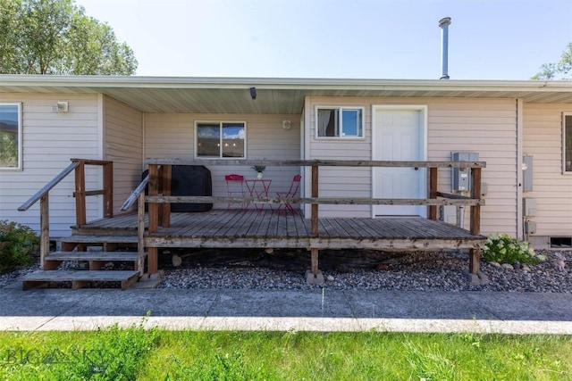 108 10th St Unit B, Belgrade, MT 59714 - back of property with a wooden deck