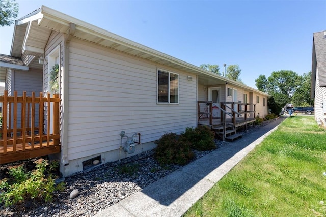 108 10th St Unit B, Belgrade, MT 59714 - view of side of home with a deck